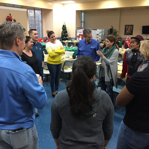 group of volunteers talking at an event